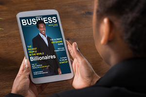 Business magazine cover on a tablet being held in front of someone
