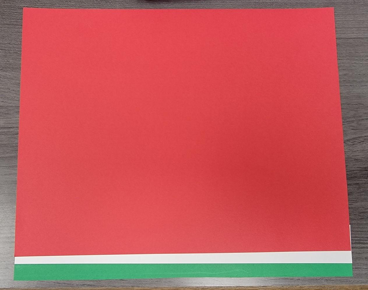 Red sheet of paper attach to white and green strips.