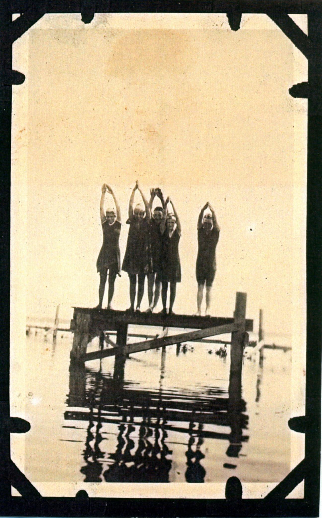 teens about to dive into the lake