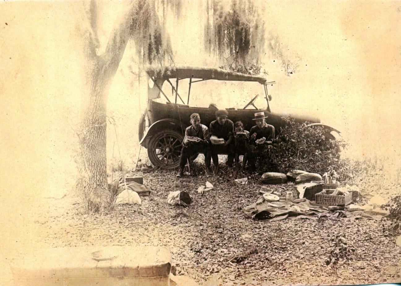 the Bell family picnicking in front of their car in the 1920s