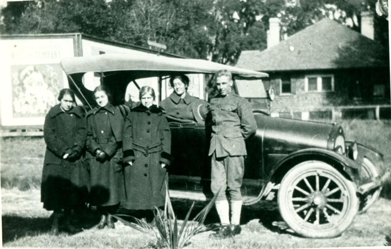 Rolf's family leaning on car Christmas 1917