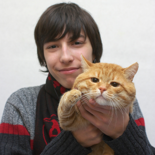Photograph of child with Cat