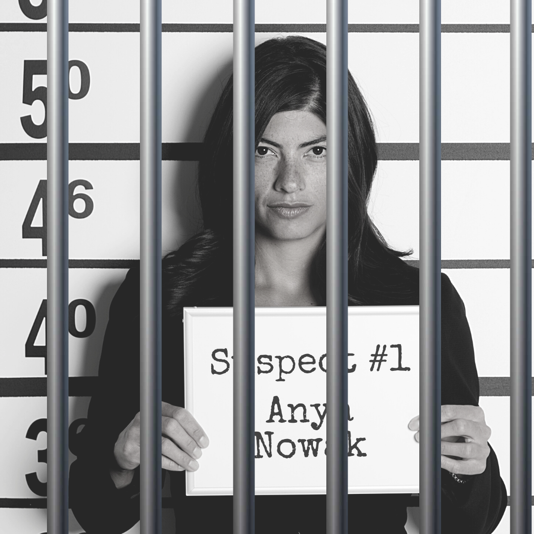 Black and white mugshot of a woman holding up a board that says "Suspect #1: Anya Nowak." There are bars over the photo.