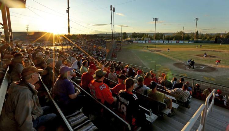 A panoramic photo of the Alaska Goldpanners stadium during a midnight sun game.