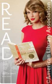 A blonde woman, Taylor Swift, holds a book ,"The Giver" by Lois Lowry, while wearing a red dress and the word "READ" is vertically written next to her on the image